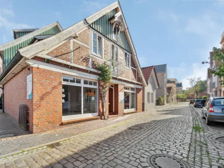 Titelbild - Haus kaufen in Cuxhaven - Beeindruckendes Wohn- und Geschäftshaus mit solider Rendite in Cuxhaven