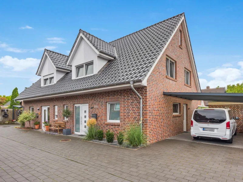 Titelbild - Haus kaufen in Lingen - Exklusives Wohnen in Altenlingen – Moderne, energieeffiziente Doppelhaushälfte mit sonnigem Garten