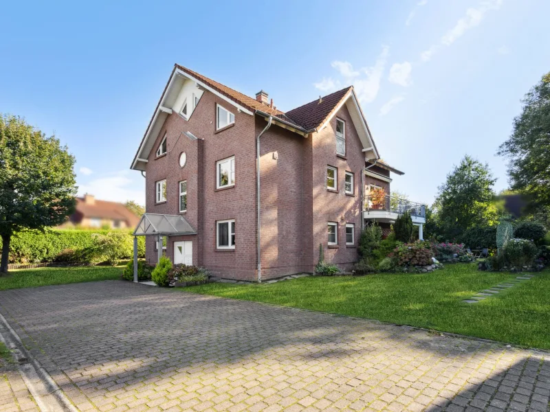 Ansicht vom Garten - Wohnung kaufen in Reinbek - Erdgeschosswohnung mit hellem Souterrain, Terrasse und Garten in Top-Lage von Reinbek-Schönningstedt