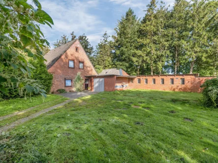 Titelbild - Haus kaufen in Süderlügum - Einfamilienhaus mit viel Potenzial in schöner Randlage in Süderlügum