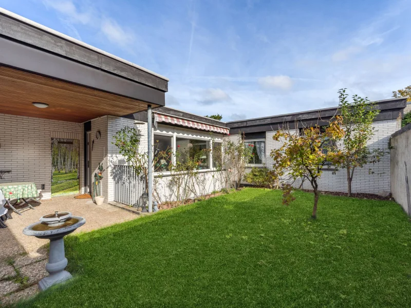 Titelbild - Haus kaufen in Erkrath - Freistehender Bungalow mit Garage in Erkrath-Hochdahl