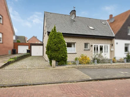 Titelbild - Haus kaufen in Rheine - Rheine links der Ems-Dorenkamp: Top gepflegtes, ca. 140 m² großes Einfamilienhaus mit vielen Extras