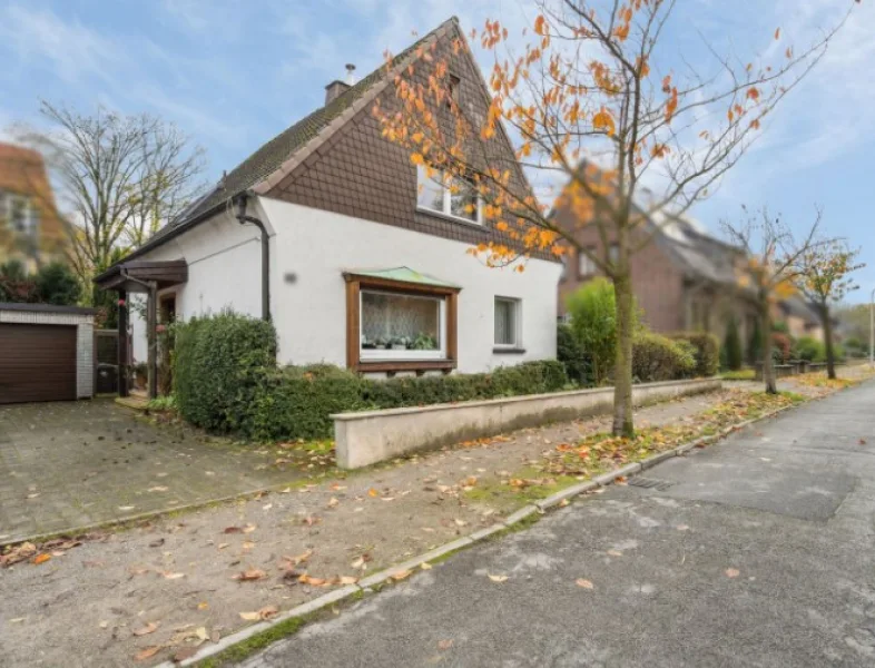 Straßenansicht - Haus kaufen in Hamm - Erbpacht: Idyllisches Einfamilienhaus mit Garage in Hamm Bockum-Hövel