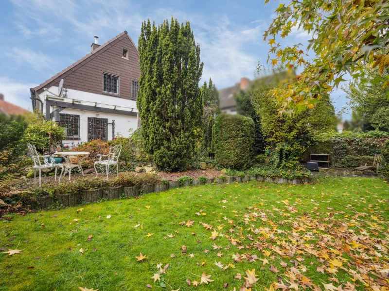 Rückansicht und Garten - Haus kaufen in Hamm - Erbpacht: Idyllisches Einfamilienhaus mit Garage in Hamm Bockum-Hövel