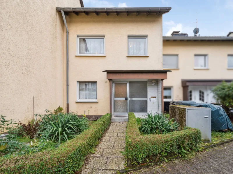 Frontansicht - Haus kaufen in Wuppertal - Gemütliches Reihenmittelhaus mit Garage in beliebter Lage von Wuppertal-Vohwinkel