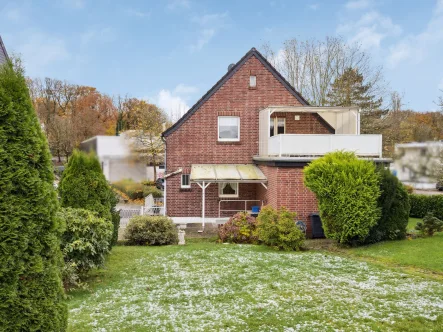 Rückansicht und Garten - Haus kaufen in Übach-Palenberg - Familienfreundliches Einfamilienhaus in zentraler und dennoch ruhiger Lage von Übach-Palenberg