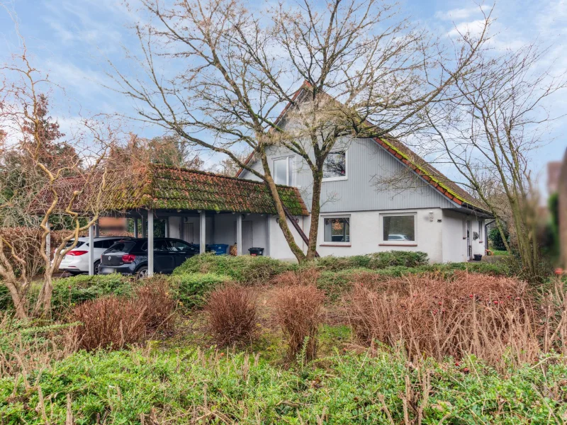 Ansicht 1 - Haus kaufen in Kirchlinteln - Vermietetes Zweifamilienhaus mit Doppelcarport in Kirchlinteln-Luttum