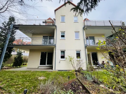   Gartenansicht - Wohnung kaufen in Dresden - Attraktive Erdgeschoßwohnung mit Gartenanteil und Tiefgarage zum Sofortbezug in Dresden-Weixdorf