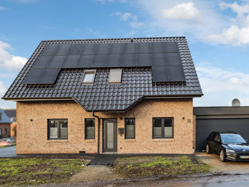 Titelfoto - Haus kaufen in Fredenbeck - Traumhaftes, großzügiges und energieeffizientes neues Einfamilienhaus im Neubaugebiet in Fredenbeck