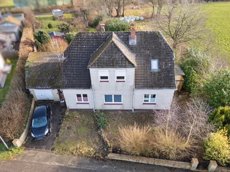 Ihr neues Zuhause - Haus kaufen in Tarbek - Tarbek: Großes, modernisiertes Ein- /Zweifamilienhaus in ruhiger und dennoch verkehrsgünstiger Lage