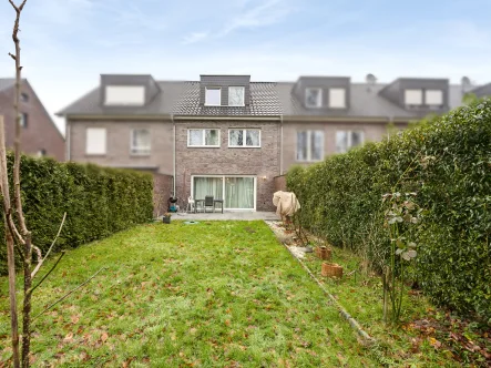 Titelbild - Haus kaufen in Münster - Attraktives und großzügiges KfW 55 Reihenmittelhaus mit Garten in Mecklenbeck