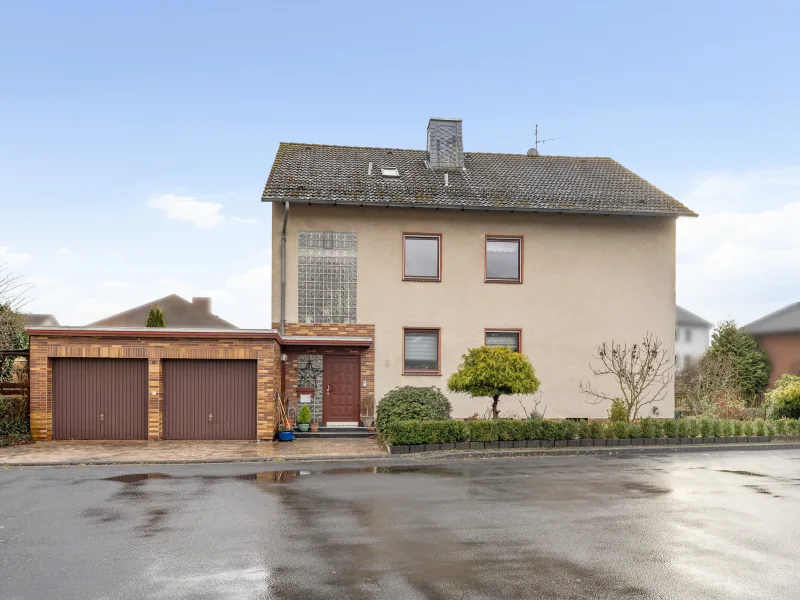 Titelbild - Haus kaufen in Fuldabrück - Zweifamilienhaus in Fuldabrück