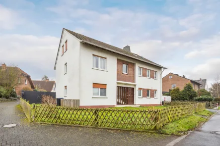 Ansicht  - Haus kaufen in Unna - Attraktives Mehrfamilienhaus mit drei Wohneinheiten, Garten und Garagen in ruhiger Lage von Unna-Hem