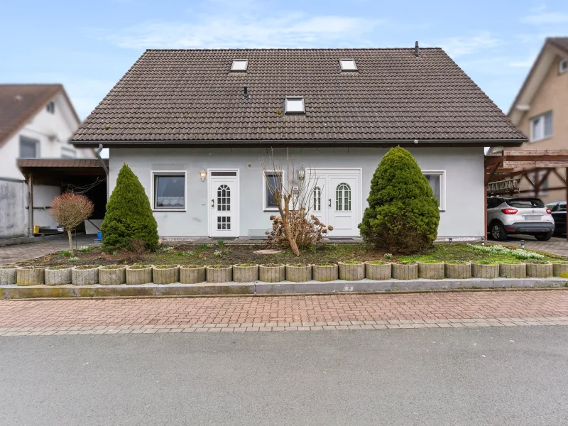 Titel - Haus kaufen in Dörentrup - Einfamilienhaus mit Einliegerwohnung in Dörentrup – Ideal für Familien oder als Mehrgenerationenhaus