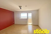 Schlafzimmer mit Zugang auf den Balkon