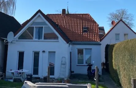 Expose 11521 Gartenansicht Bild 2 - Haus kaufen in Barßel - Einmalige Gelegenheit im Seemannsort! Komplett vermietetes Wohnhaus im Ortskern zu verkaufen