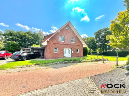 12924 Vorderansicht - Haus kaufen in Barßel / Barßelermoor - Blick ins Grüne !Wunderschönes Einfamilienhaus mit Einbauküche im Hafenort Barßel