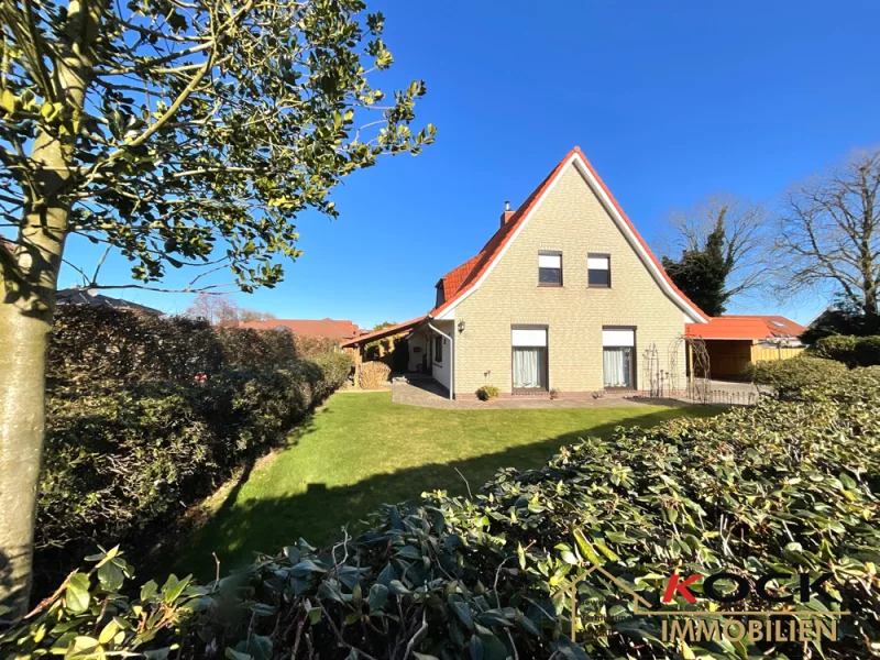 11725 Vorderansicht  - Haus kaufen in Barßel / Neuland - Aufwendig modernisiert, Schmuckstück präsentiert! 2 Küchen, Doppelcarport, Garten, 2 Terrassen u.v.m