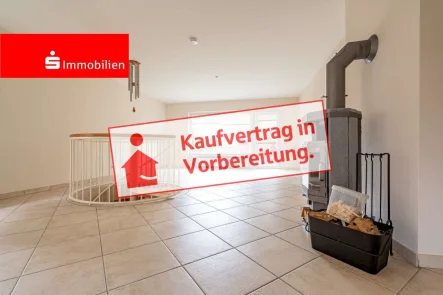 Wohn- und Essbereich - Wohnung kaufen in Elmshorn - Erdgeschosswohnung nebst Souterrainbereich, eigener Terrasse, Garage und Ofen im offenen Wohnbereich! 