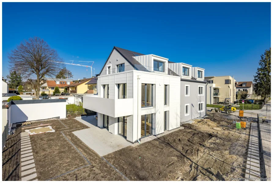 Ansicht Neubau - Haus kaufen in München - BEZUGSFERTIGER NEUBAU – architektonisch ansprechendes Mehrfamilienhaus in herrlicher Lage!
