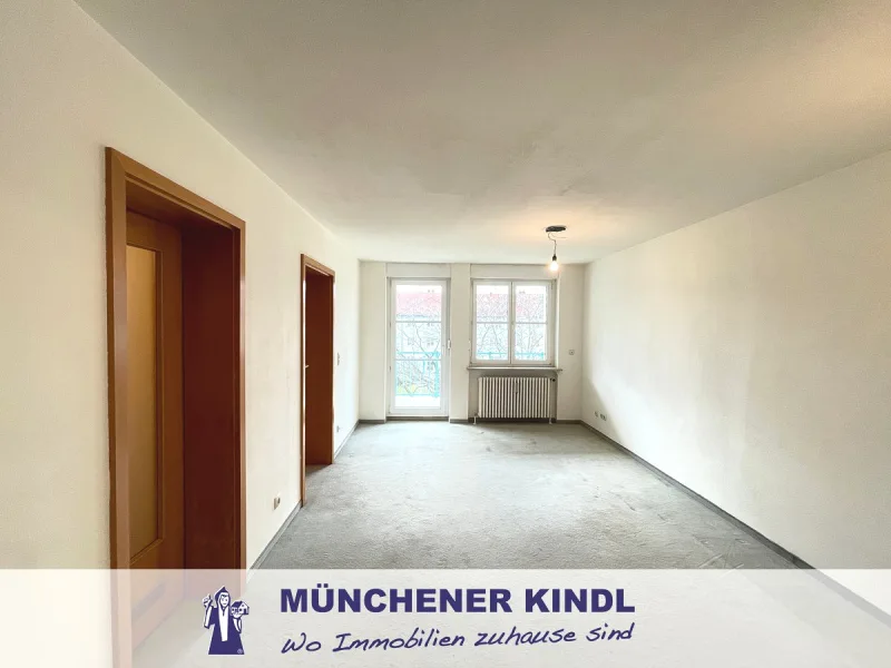 Wohnzimmer - Wohnung kaufen in München - Charmante 1,5 Zimmer Wohnung mit Südbalkon in ruhiger Lage