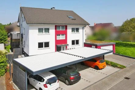 Straßenansicht - Haus kaufen in Rheinmünster / Greffern - Rundum erneuertes Dreifamilienhaus mit Sonnengrundstück!