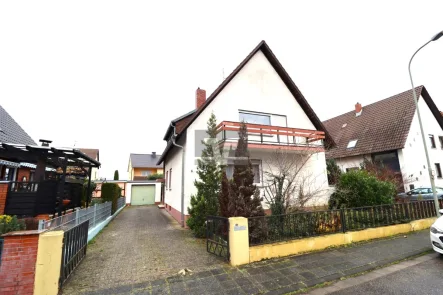 Titelbild - Haus kaufen in Mutterstadt - Einfamilienhaus - Familienhaus mit2 Wohnungen in ruhiger und beliebter Lage!