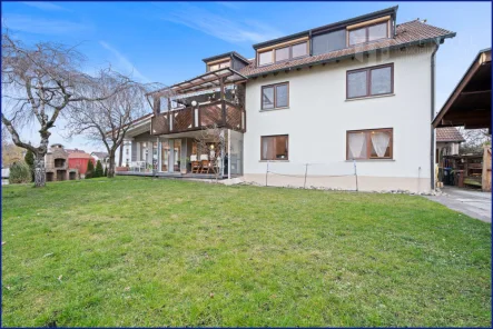 Aussenaufnahme - Haus kaufen in Tettnang / Bürgermoos - Horizontal geteilte Haushälfte mit großzügigem Garten und Garagenstellplatz