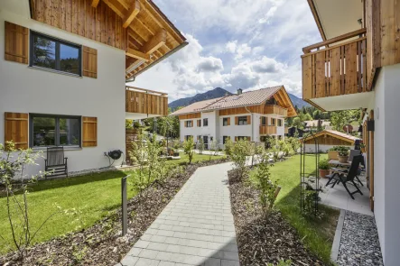 Alpen-Immo_MFH_Lebenstraum_Neuhaus_02 - Wohnung kaufen in Schliersee - Neuwertig & bezugsfrei - Erdgeschoss-Wohnung mit sonnigen Terrassen, Garten und Tiefgarage