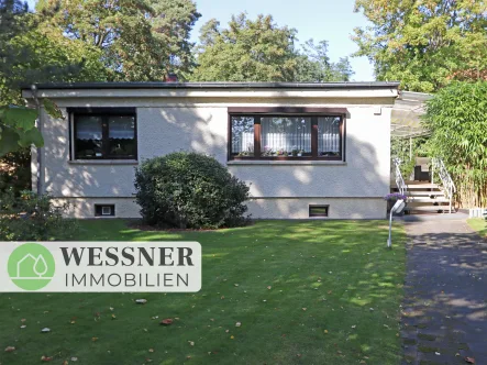 Titelbild - Haus kaufen in Falkensee - Charmanter Bungalow mit geräumigem Keller und großer überdachter Terrasse