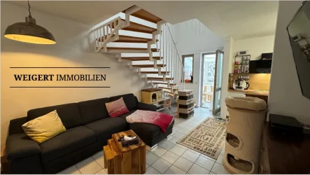 Exemplarische Ansicht Wohnzimmer - Wohnung kaufen in Olching - WEIGERT: Ansprechende Maisonette-Wohnung mit Wintergarten, TG & Außenstellplatz in Olching