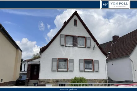Titelbild - Haus kaufen in Weiterstadt - Charmantes Einfamilienhaus mit Potenzial