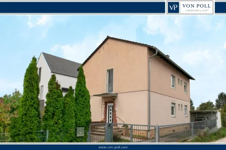 Titelbild  - Haus kaufen in Langen (Hessen) - Modernisiertes 2-Familienhaus mit großzügigem Grundstück in Top-Lage