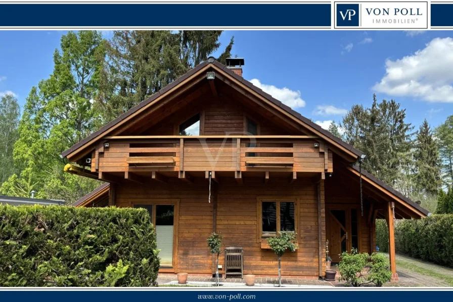 Titel - Haus kaufen in Mühlenbeck - Idyllischer und individuell Leben - hochwertiges Blockbohlenhaus mit luxuriösem Wintergarten