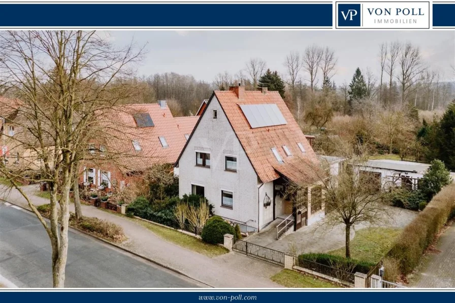 Titelbild - Haus kaufen in Bienenbüttel - Wohnen & Natur in perfekter Harmonie! Vielseitiges Ein- oder Zweifamilienhaus mit großem Grundstück