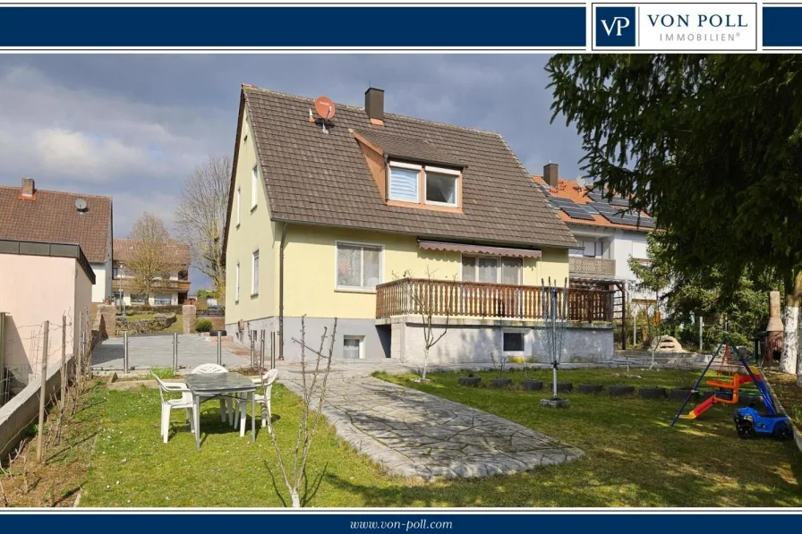 Haus Gartenseite - Haus kaufen in Bergtheim - Zwei-Parteienhaus in ruhiger Lage mit gepflegten Garten zu verkaufen