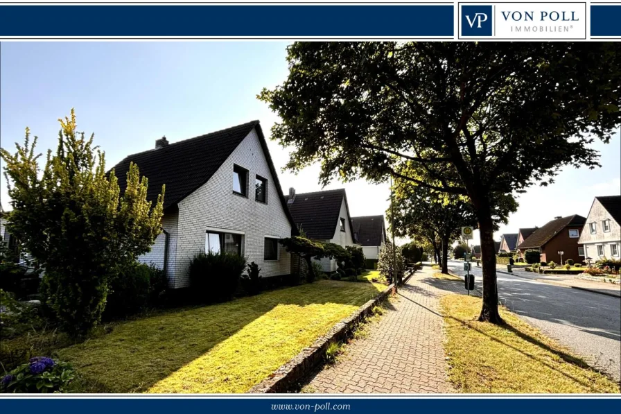 Titelbild - Haus kaufen in Neumünster - Familienfreundliches Wohnen mit großem Anbau und idyllischem Garten in Neumünster-Gadeland