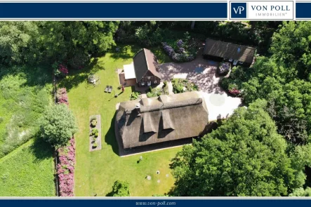 Titelbild - Haus kaufen in Bad Zwischenahn - Luxuriöses Reetdachanwesen mit großzügigen Grundstück in idyllischer Lage