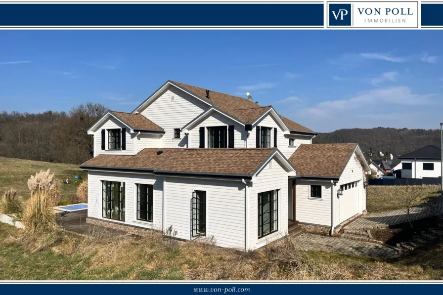 Seitenansicht - Haus kaufen in Niedererbach - Modernes Wohnhaus im amerikanischen Stil und freiem Feldblick; Baujahr 2017