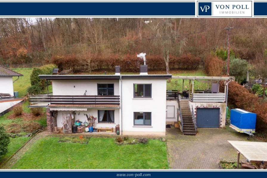 Titelbild - Haus kaufen in Montabaur / Reckenthal - Modernisiertes Einfamilienhaus im Grünen und ruhiger Wohnlage