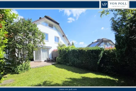 Gartenansicht - Haus kaufen in Usingen - Liebevoll modernisierte DHH mit Kamin, Garage und Stellplatz in beliebter Lage von Usingen