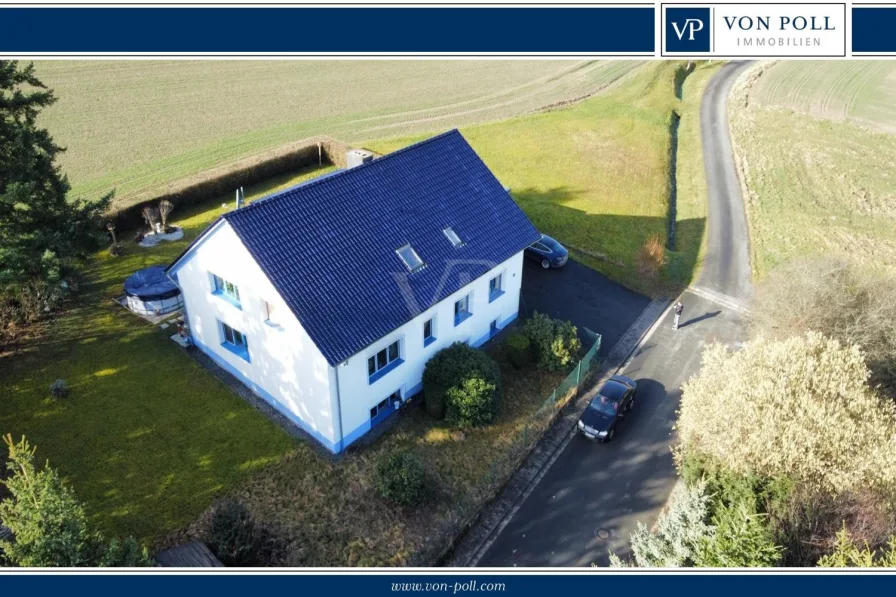 Herrliche Feldrandlage - Haus kaufen in Weilrod - Ein Panorama zum Verlieben, am Feld- & Waldrand: Großzügiges 2-Fam.-Haus plus ELW und Doppelgarage