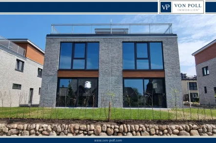 Terrassenseite - Haus kaufen in Kappeln - Neubaudoppelhaushälfte mit eindrucksvollem Schleiblick auf den Schleiterrassen in Kappeln.