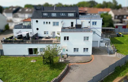 Titelbild - Wohnung kaufen in Saarlouis / Roden - Lichtdurchflutete 2-Zimmer-Obergeschosswohnung