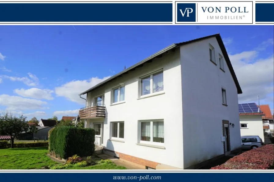 Titelbild - Haus kaufen in Eiterfeld / Wölf - Klassisches Zweifamilienhaus in Ortsrandlage