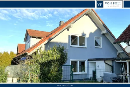 Titel - Haus kaufen in Fulda / Edelzell - Freistehendes Einfamilienhaus mit großer Einliegerwohnung, Hybrid-Heizung und PV-Anlage