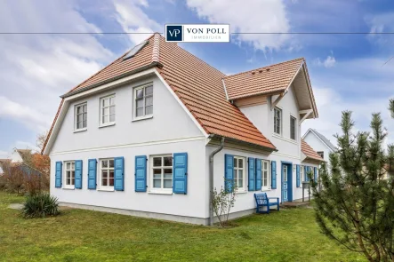 Titelbild - Wohnung kaufen in Wustrow - Attraktive Erdgeschosswohnung mit großzügiger Terrasse