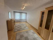 Wohnzimmer mit originalem Dielenfußboden