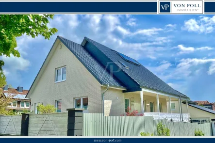 Titelbild - Haus kaufen in Uelzen - Exklusives Einfamilienhaus mit Traumgarage in bevorzugter Lage