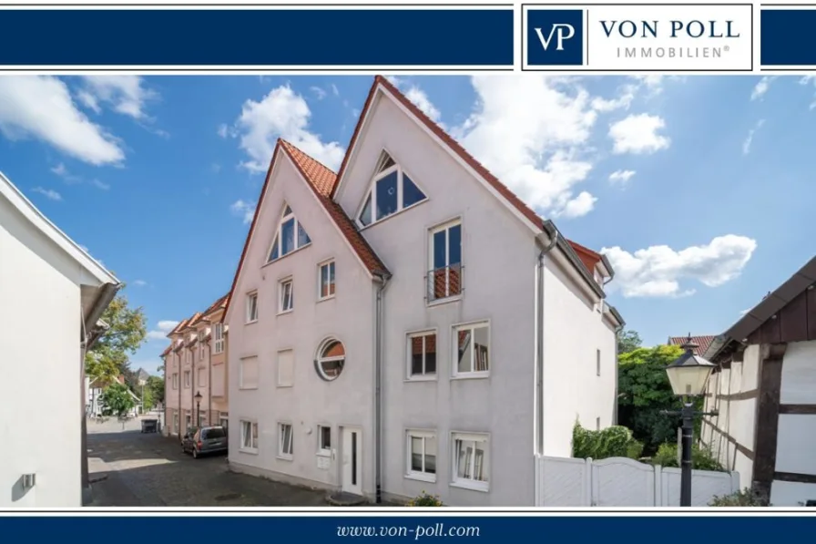Titelbild - Wohnung kaufen in Rheda-Wiedenbrück - Schicke Eigentumswohnung in einem gepflegten Mehrfamilienhaus in der Altstadt von Rheda